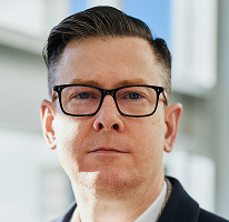Alexander Hughes, chief executive officer at a cryptocurrency trading company, headshot.